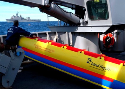 US Navy 071204-N-2838W-124 A member of the training support vessel Prevail's (TSV 1) civilian crew prepares to launch a