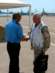 US Navy 030423-N-1050K-001 (From left to right) Maj. Gen. Ahmed Y. Al Mulla, Commander, Kuwait Naval Forces, greets Vice Adm. Timothy J. Keating, Commander, Fifth Fleet and U.S. Naval Forces Central Command, during a recent vis