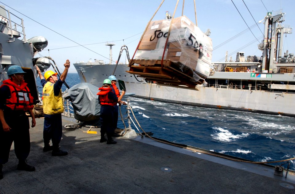 US Navy 030406-N-6141B-006 Deck Department personnel receive stores via a replenishment at sea (RAS)