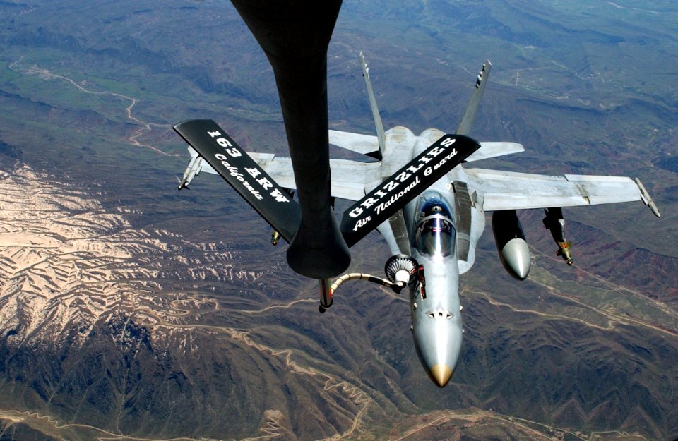 US Navy 030411-N-0780F-089 An F-A-18 Hornet strike fighter embarked aboard USS Harry S. Truman (CVN 75) receives fuel from an Air National Guard Boeing KC-135 Stratotanker