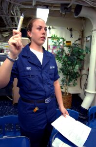 US Navy 030401-N-6141B-007 Hospital Corpsman Tiffany Reid of Manassas, Va., instructs crewmembers on the proper use of 2-Pan Chloride injectors aboard USS Donald Cook (DDG 75)