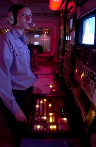 US Navy 030411-N-8273J-009 Operation Specialist 3rd Class Carla Morton of Chattanooga, Tenn., runs the production controls for the evening news broadcast in the television studio, aboard USS Nimitz (CVN 68)
