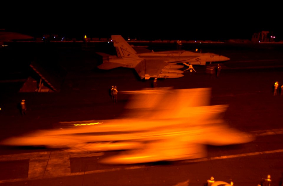 US Navy 030502-N-2385R-003 An F-A-18F Super Hornet prepares to take off from one of four steam-powered catapults during night flight operations on the flight deck aboard USS Nimitz (CVN 68)