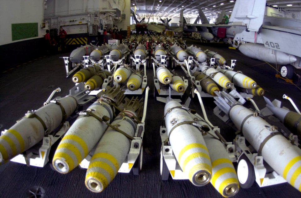 US Navy 030403-N-2385R-001 In the hangar bay aboard USS Nimitz (CVN 68), ordnance is inspected prior to being transported to the ship's flight deck and uploaded onto various aircraft