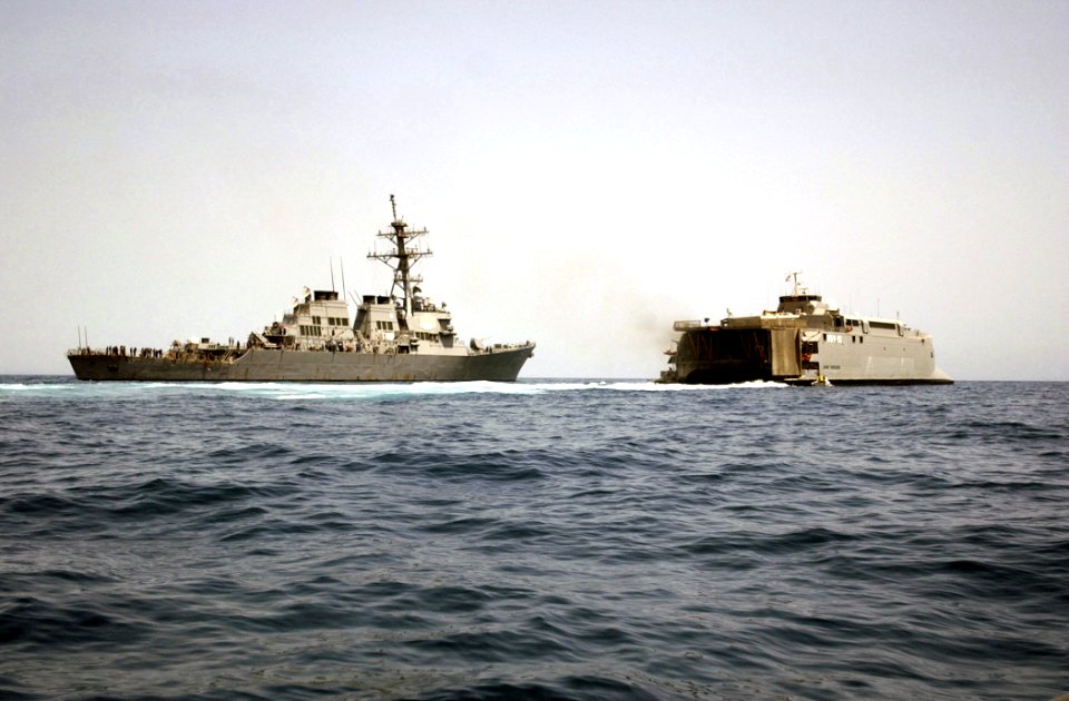 US Navy 030414-N-6141B-004 Personnel assigned to Deck Department aboard the guided missile destroyer USS Mitscher (DDG 57) conduct a small boat transfer with USS Joint Venture (HSX-V1)