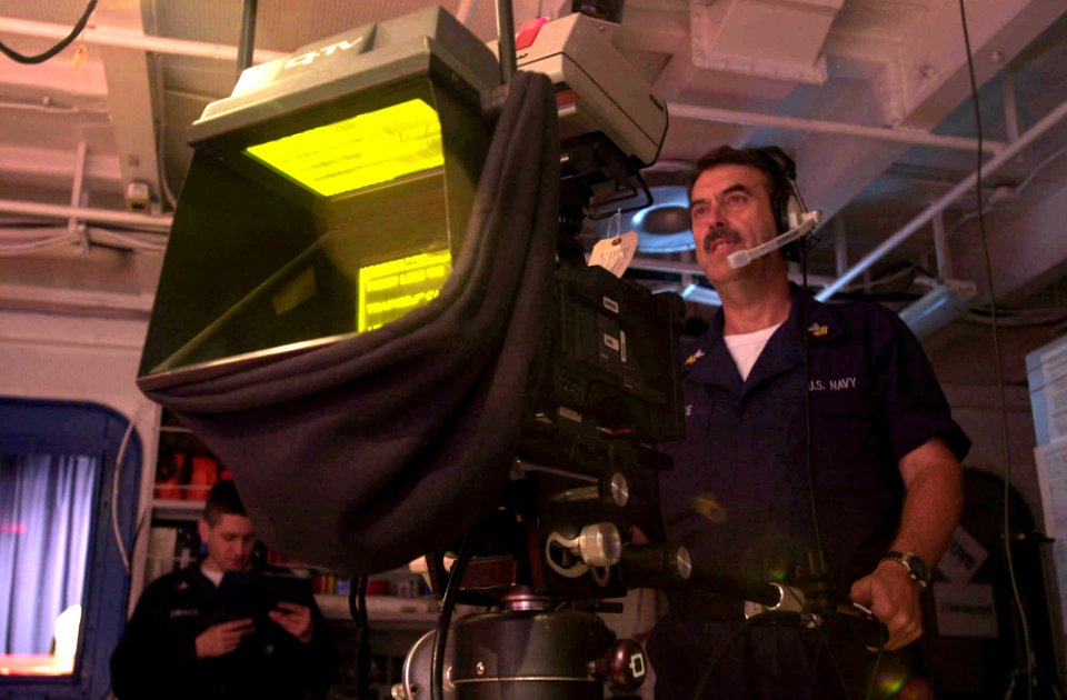 US Navy 030411-N-8273J-005 Journalist 1st class Fred Stoecke of San Diego, Calif. takes cues from the director during the live evening news broadcast in the television studio, aboard USS Nimitz (CVN 68)