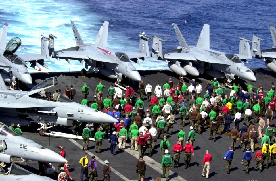 US Navy 030327-N-2385R-002 USS Nimitz (CVN 68) and Carrier Air Wing Eleven (CVW-11) personnel perform a Foreign Object Damage (FOD) walkdown on the ship's flight deck