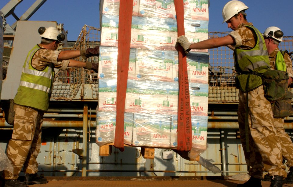 US Navy 030328-N-2513W-063 Bottled water is delivered by crane to the port of Umm Qasr