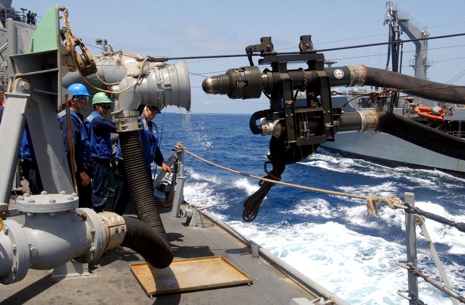 US Navy 030420-N-6141B-008 The Military Sea Lift Command, fleet oilier USNS Kanawha (T-AO 196) refueling probe pulls away from the guided missile destroyer USS Mitscher (DDG 57) concluding part of an underway replenishment (UNR