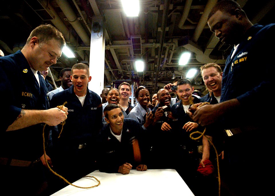 US Navy 030329-N-4048T-088 Chief Boatswain's Mates Kelvin Dickey (left) and Chief Petty Officer George Gainey square off in a knot-tying contest