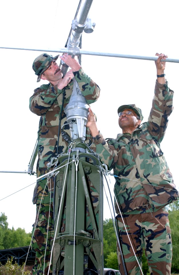 US Navy 030515-F-5281B-003 U.S. Navy Chief Petty Officer Harry Goldsmith and Petty Officer 2nd Class Tom Shupe assemble a Logyrthmic Periodic Antenna during exercise Combined Endeavor 2003