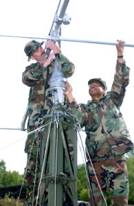 US Navy 030515-F-5281B-003 U.S. Navy Chief Petty Officer Harry Goldsmith and Petty Officer 2nd Class Tom Shupe assemble a Logyrthmic Periodic Antenna during exercise Combined Endeavor 2003