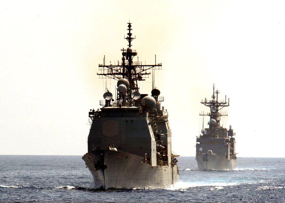 US Navy 030420-N-6141B-001 The guided missile cruiser USS Cape St. George (CG 71) and the destroyer USS Deyo (DD 989) steam in formation while awaiting to conduct an underway replenishment (UNREP) with the Military Sea Lift Com