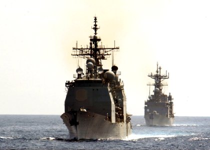 US Navy 030420-N-6141B-001 The guided missile cruiser USS Cape St. George (CG 71) and the destroyer USS Deyo (DD 989) steam in formation while awaiting to conduct an underway replenishment (UNREP) with the Military Sea Lift Com