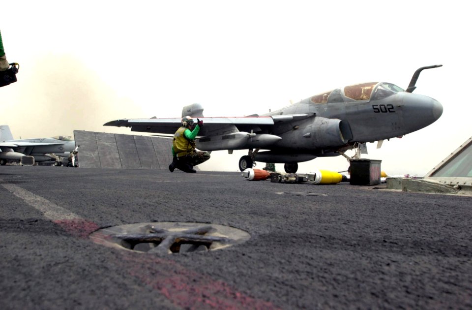 US Navy 030517-N-2385R-005 An EA-6B Prowler assigned to the Black Ravens of Electronic Attack Squadron One Three Five (VAQ-135) prepares to take off from one of four steam-powered catapults during flight operations on the fligh