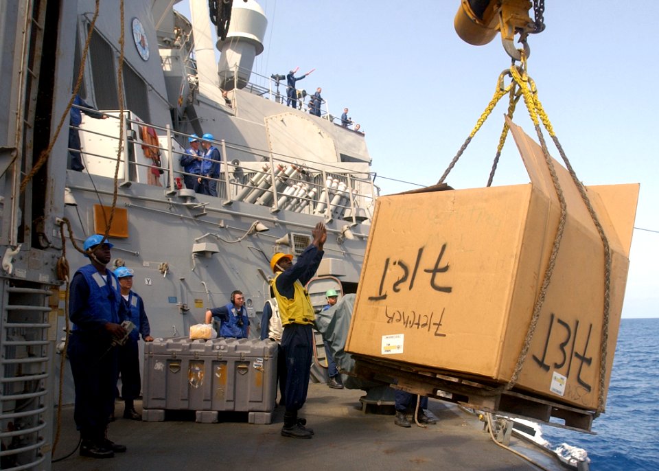 US Navy 030420-N-6141B-006 The guided missile destroyer USS Mitscher (DDG 57) Deck Department receive stores via a connected replenishment (CONREP) with the Military Sea Lift Command, fleet oilier USNS Kanawha (T-AO 196)