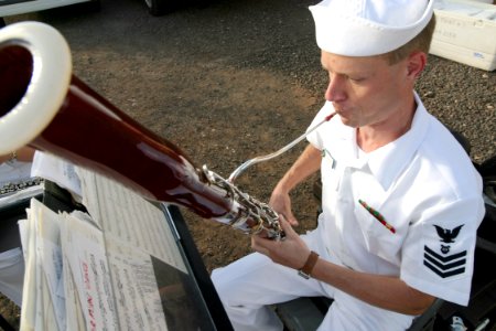 US Navy 030426-N-3228G-001 Musician 1st Class Sterling Strickler assigned to Pacific Fleet Band's Woodwind Quinter warms up his bassoon shortly before the arrival of the guided missile destroyer USS Paul Hamilton