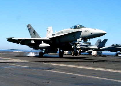 US Navy 030519-N-5786V-501 An F-A-18C Hornet assigned to the War Party of Strike Fighter Squadron Eight Seven (VFA-87) lands on the flight deck of USS Theodore Roosevelt (CVN 71)