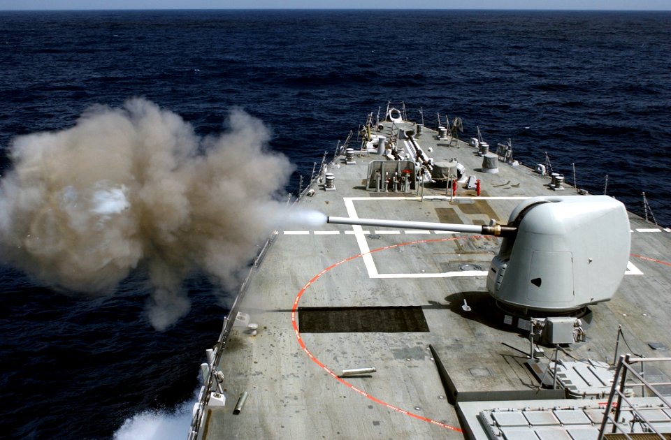 US Navy 030423-N-6141B-001 The guided missile destroyer USS Donald Cook (DDG 75) crewmembers conduct a Pre-Action Calibration fire from the ship's forward 5