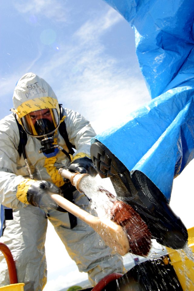 US Navy 030522-N-3228G-006 A survey team member is washed down in a decontamination line during a weapons of mass destruction exercise