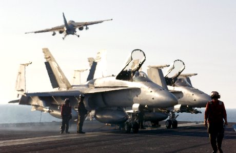 US Navy 030402-N-1810F-005 F-A-18C Hornets are positioned on the bow of USS Kitty Hawk (CV 63) during flight operations
