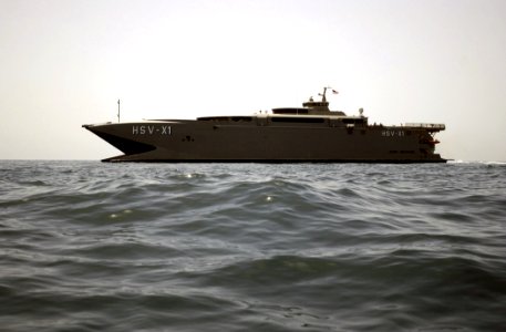 US Navy 030414-N-6141B-049 Joint Venture (HSX-V1) prepares to receive a small boat from the guided missile destroyer USS Mitscher (DDG 57) during underway operations