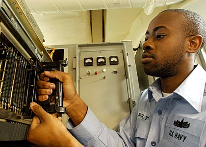 US Navy 030523-N-1512S-033 Fire Controlman 3rd Class Andre Holt checks his equipment