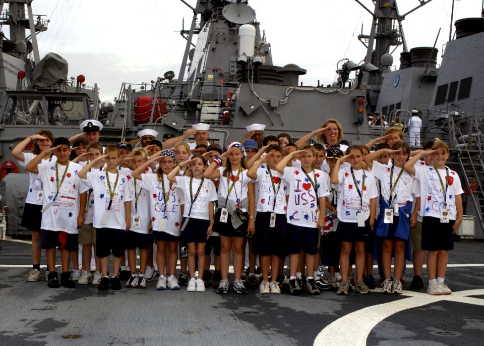 US Navy 030501-N-8787A-001 Students from the Spanish River Christian School, Boca Raton, Fla., salute with Sailors aboard USS Cole (DDG 67) after taking a ship's tour during Fleet Week USA