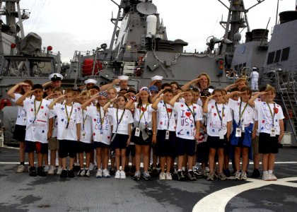 US Navy 030501-N-8787A-001 Students from the Spanish River Christian School, Boca Raton, Fla., salute with Sailors aboard USS Cole (DDG 67) after taking a ship's tour during Fleet Week USA