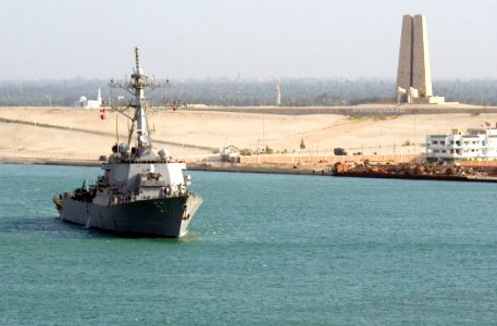 US Navy 030426-N-6141B-017 The guided missile destroyer USS Mitscher (DDG 57) passes a memorial built in recognition of the defense of the Suez Canal from 1914-1918 while transiting the Suez Canal