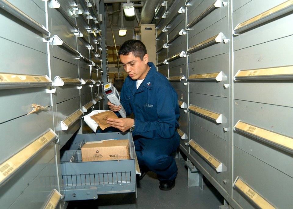 US Navy 030430-N-2819P-022 Store Keeper 3rd Class Alan Ganoza inventories stock items in Main Supply Issue aboard USS Kearsarge (LHD 3)