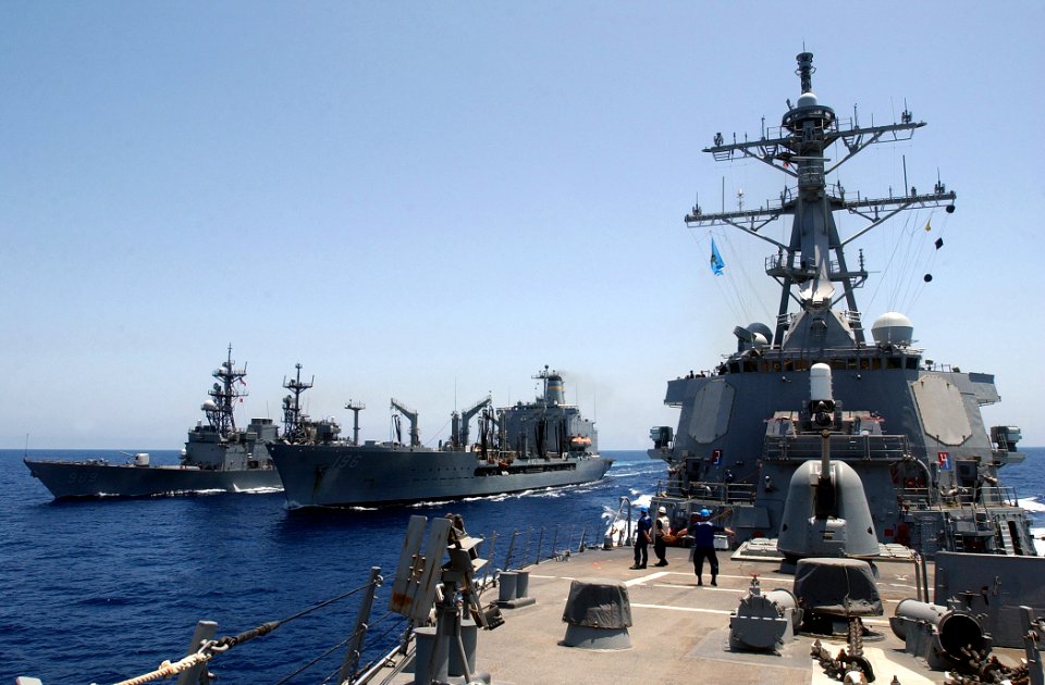 US Navy 030420-N-6141B-010 The guided missile destroyer USS Mitscher (DDG 57) conducts high-speed maneuvers after an underway replenishment with the Military Sea Lift Command, fleet oilier USNS Kanawha (T-AO 196)