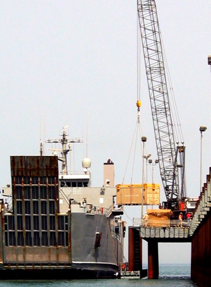 US Navy 030511-N-1050K-044 A U.S. Army Logistics Support Vessel (LSV) pulls alongside the U.S. Navy Elevated Causeway System-Modular (ELCAS-M) for equipment offload during continued Joint Logistics Over The Shore (JLOTS) operat
