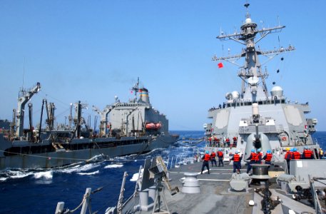US Navy 030427-N-6141B-004 The guided missile destroyer USS Donald Cook (DDG 75) receive stores and fuel via a connected replenishment