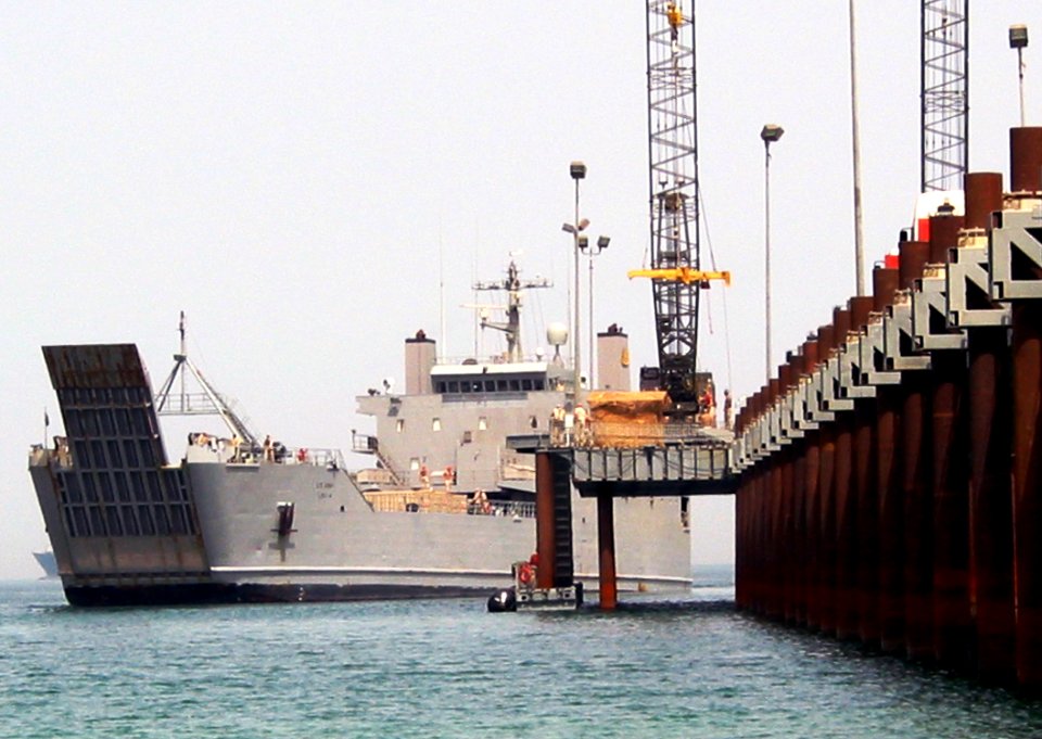 US Navy 030511-N-1050K-029 A U.S. Army Logistics Support Vessel (LSV) pulls alongside the U.S. Navy Elevated Causeway System-Modular (ELCAS-M) for equipment offload during continued Joint Logistics Over The Shore (JLOTS) operat