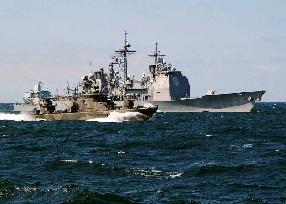 US Navy 030613-N-4374S-008 A Finish Rauma-class fast patrol boat, steams along side the Aegis class, guided missile cruiser USS Vella Gulf (CG 72) in the Baltic Sea during the annual maritime exercise Baltic Operations 2003 (BA