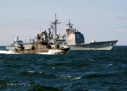 US Navy 030613-N-4374S-008 A Finish Rauma-class fast patrol boat, steams along side the Aegis class, guided missile cruiser USS Vella Gulf (CG 72) in the Baltic Sea during the annual maritime exercise Baltic Operations 2003 (BA