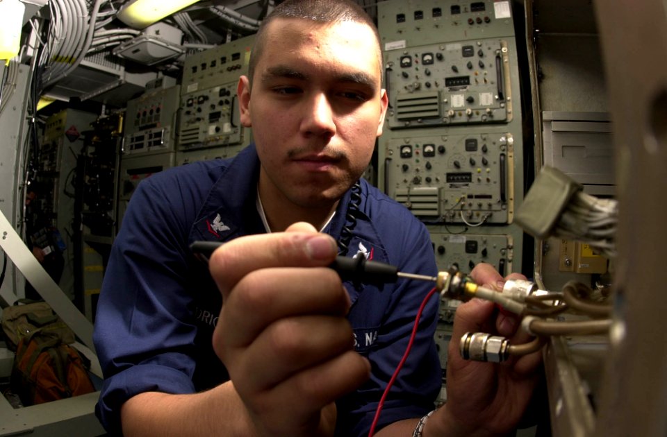 US Navy 030503-N-2143T-004 Electronics Technician 3rd Class Miguel Rodriguez of Los Angles, Calif., takes resistance checks aboard USS Nimitz (CVN 68)