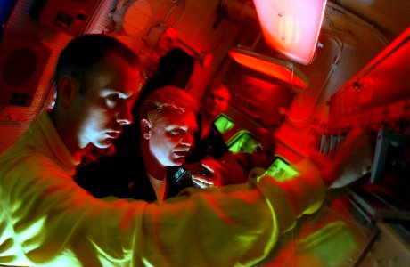 US Navy 030506-N-0696M-107 Aviation Boatswain's Mate Airman Jeremy Coon and the ship's fire marshal Chief Warrant Officer Stanley Flem test the Aqueous Film Forming Foam (AFFF)