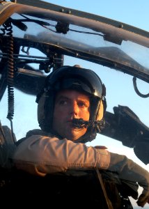 US Navy 030602-N-2819P-020 Capt. Michael M. Richman, a pilot assigned to Marine Attack Light Attack Helicopter Squadron Two Sixty Nine (HMA-L-269) performs pre-start checks on his AH-1W Cobra