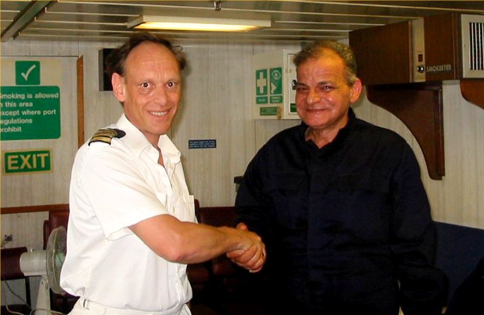 US Navy 030624-D-0000X-001 The Commanding Officer of the British Royal Navy's landing ship logistic RFA Sir Tristram (L 3505) shakes hands with one of the rescued crewmembers of the ill fated Egyptian cargo ship MV Green