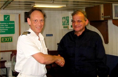 US Navy 030624-D-0000X-001 The Commanding Officer of the British Royal Navy's landing ship logistic RFA Sir Tristram (L 3505) shakes hands with one of the rescued crewmembers of the ill fated Egyptian cargo ship MV Green photo