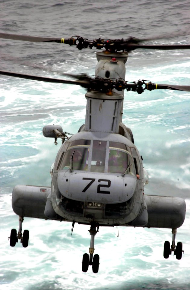 US Navy 030422-N-2385R-006 A CH-46 Sea Knight transfers supplies from fast combat support ship USS Bridge (AOE 10) to USS Nimitz (CVN 68) during a Connected Replenishment (CONREP)