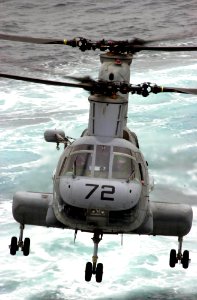 US Navy 030422-N-2385R-006 A CH-46 Sea Knight transfers supplies from fast combat support ship USS Bridge (AOE 10) to USS Nimitz (CVN 68) during a Connected Replenishment (CONREP)