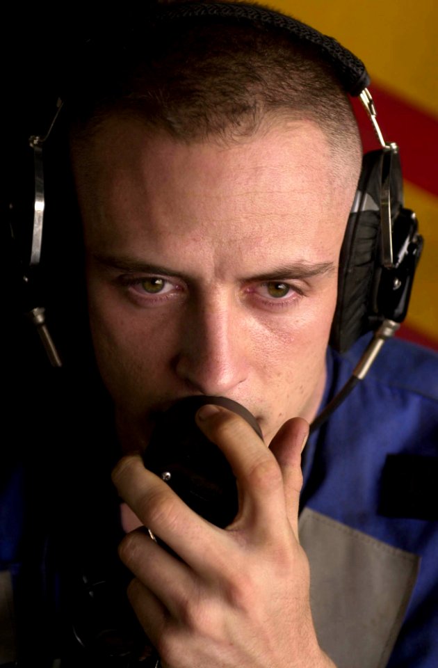 US Navy 030601-N-0413R-002 Airman Bradley Smith from Tucson, Ariz., performs the duties of phone talker