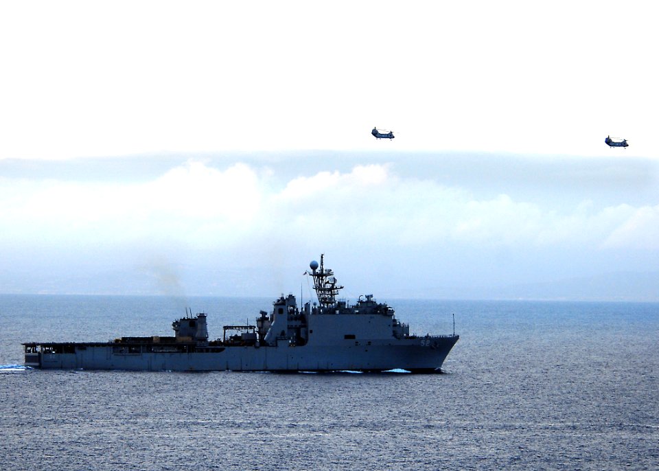 US Navy 100330-N-7948R-199 Two CH-46 Sea Knight helicopters fly over USS Pearl Harbor (LSD 52)