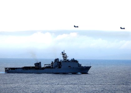 US Navy 100330-N-7948R-199 Two CH-46 Sea Knight helicopters fly over USS Pearl Harbor (LSD 52)