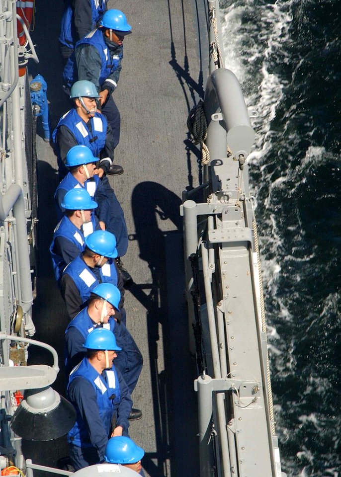 US Navy 030612-N-4374S-010 Sailors aboard the Aegis class, guided missile cruiser USS Vella Gulf (CG 72) heave on a stanchion line to receive the fuel line during the underway replenishment with the German oiler FGS Rhoen (A 1