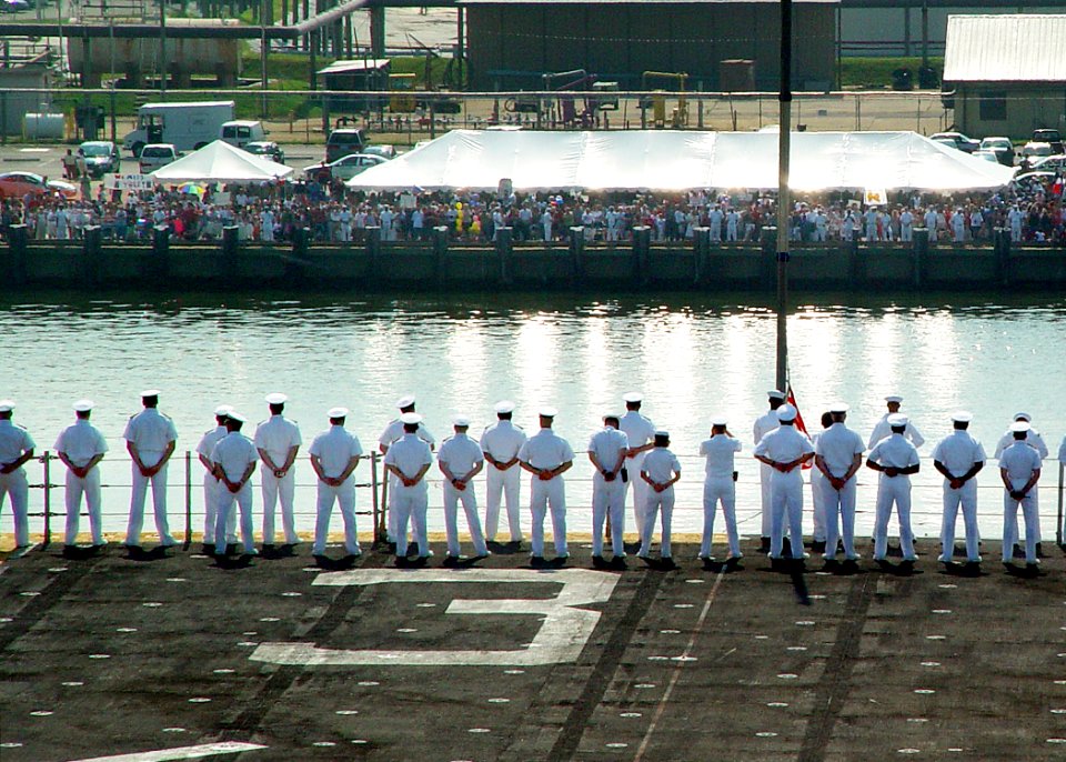 US Navy 030630-N-2972R-089 Sailors man the rails as USS Kearsarge (LHD 3) pulls in to Naval Station Norfolk