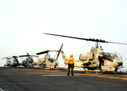 US Navy 030611-N-2819P-033 An AH-1W Cobra stands by to be launched if needed, as the amphibious assault ship USS Kearsarge (LHD 3) passes through the Strait of Gibraltar